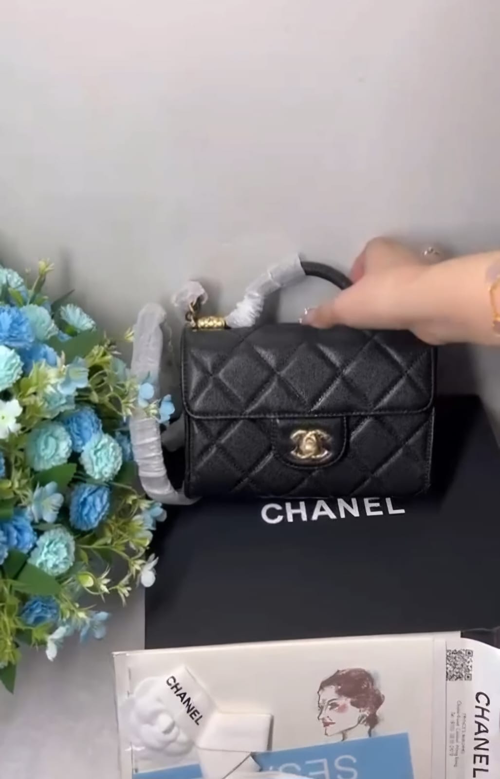 flap bag with top handle