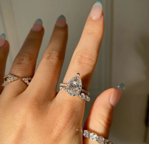 Pear Cut Solitaire Ring with Pavé Band